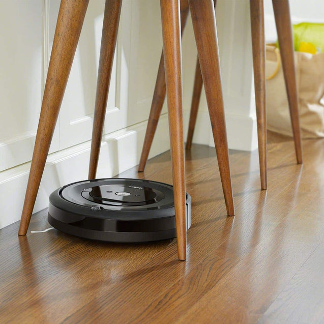 iRobot-Roomba-i7-Wi-Fi-Connected-Robot-Vacuum-Cleaner-listing-under-chair